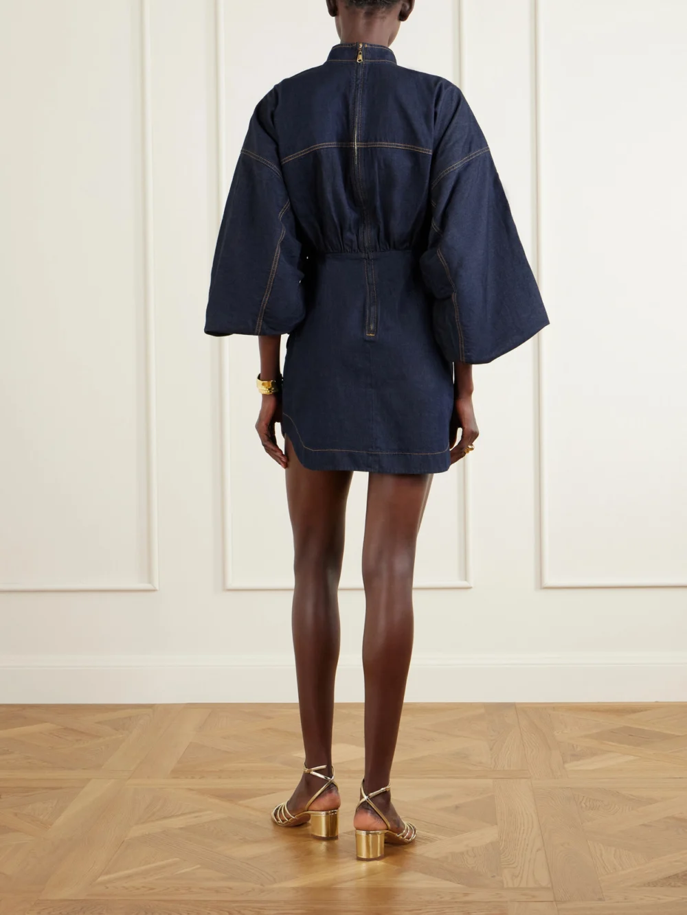 Back view of the Zimmermann Gathered Denim Mini Dress