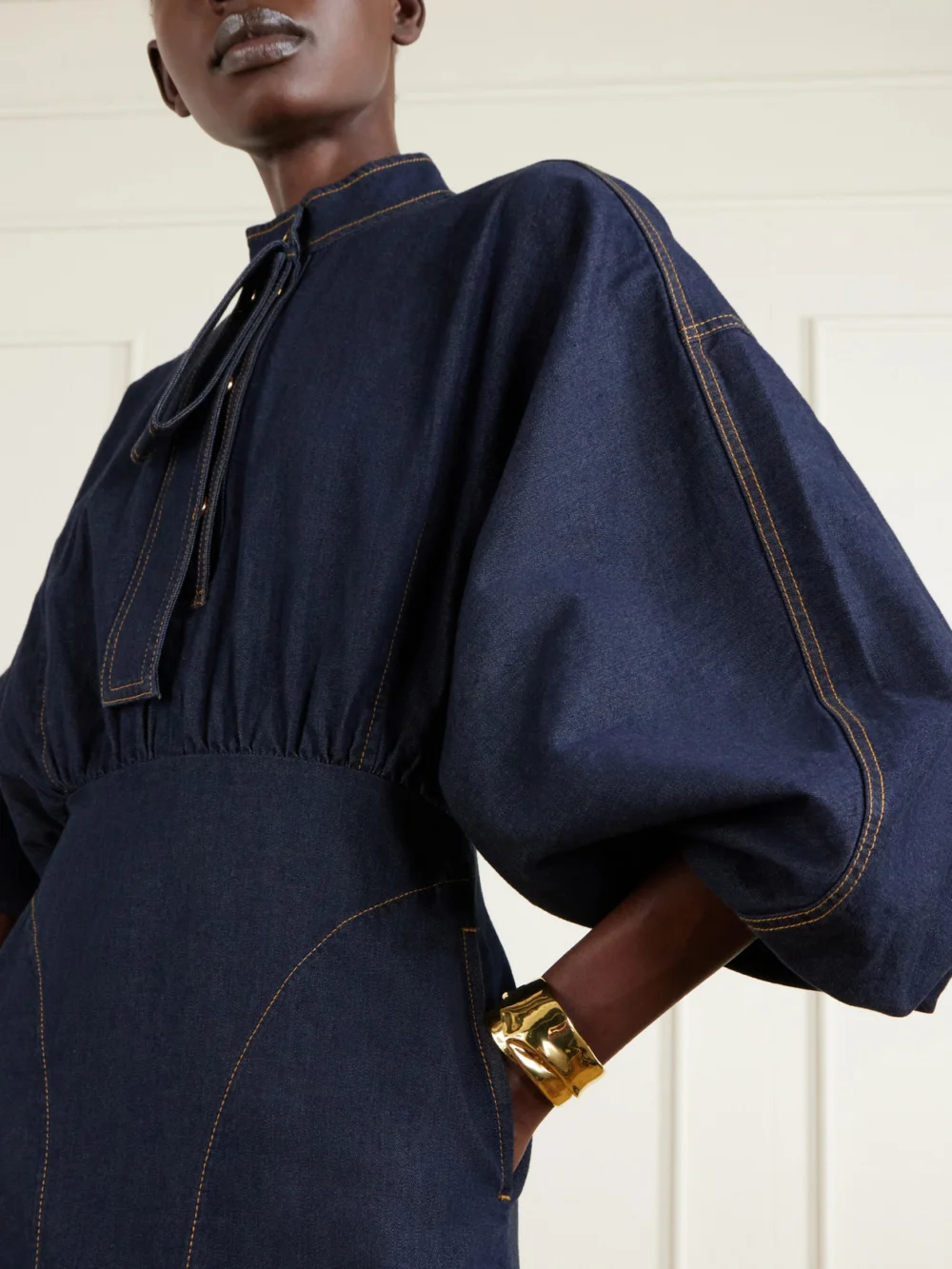Close-up detail of the Zimmermann Gathered Denim Mini Dress