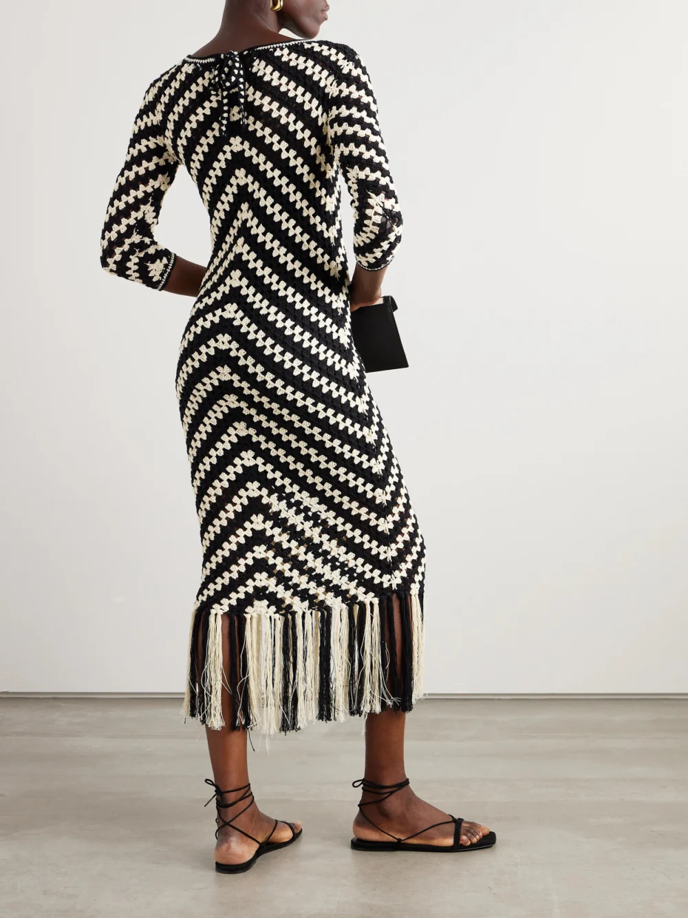 Back view of the Zimmermann Halliday Fringed Crocheted Cotton Midi Dress