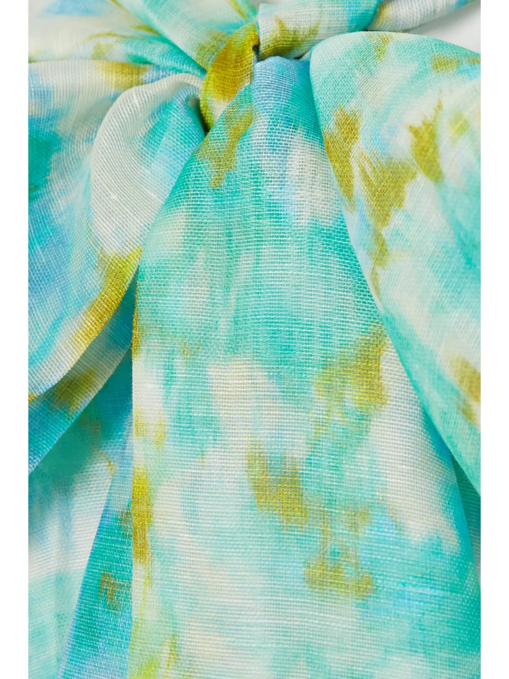 Close-up detail of the Zimmermann High Tide Cropped Twist-front Floral-print Linen and Silk-blend Top