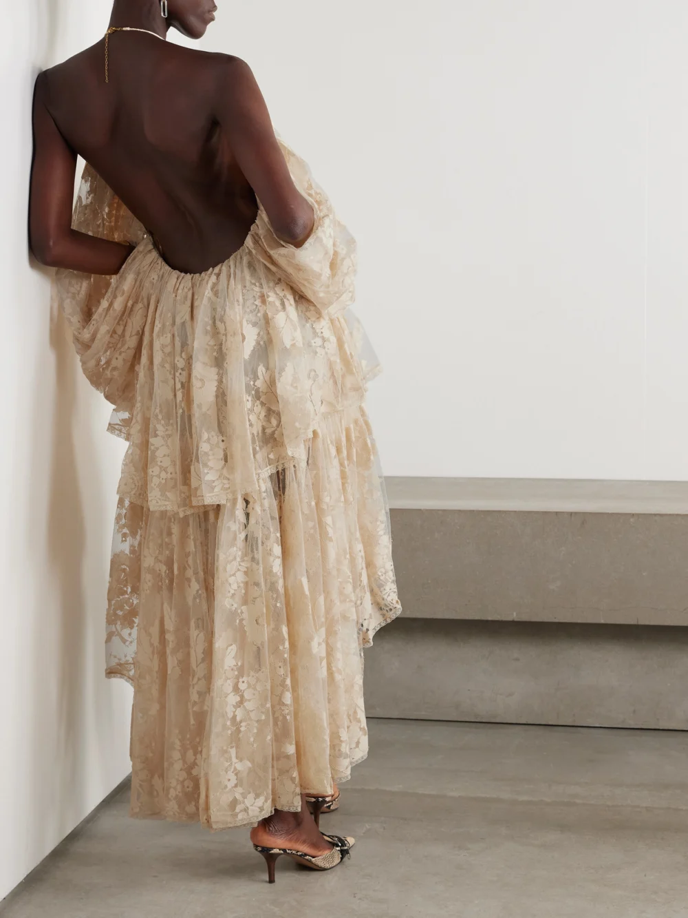 Back view of the Zimmermann Illustration Open-back Tiered Pleated Cotton-blend Lace Halterneck Mini Dress