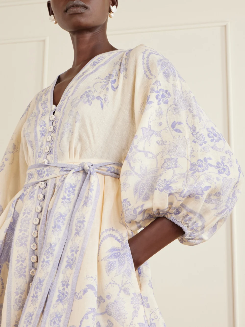 Close-up detail of the Zimmermann Indra Belted Floral-print Linen Mini Dress