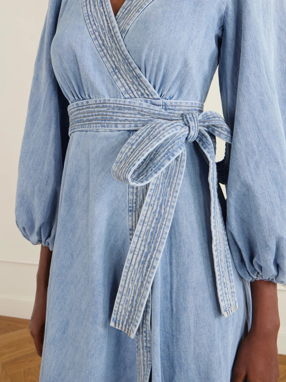 Close-up detail of the Zimmermann Indra Denim Midi Dress
