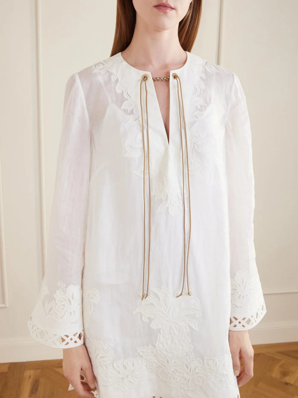 Close-up detail of the Zimmermann Indra Embroidered Ramie Mini Dress