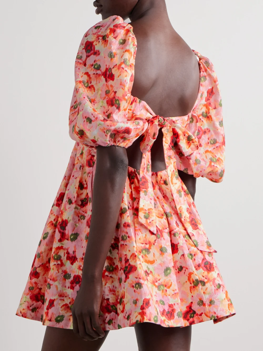 Back view of the Zimmermann Lightburst Pleated Cutout Floral-print Linen Mini Dress