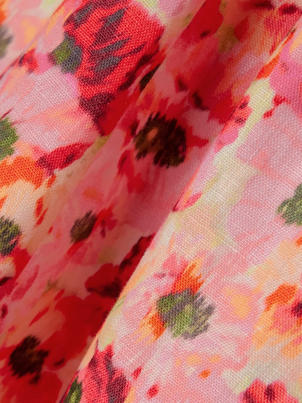 Close-up detail of the Zimmermann Lightburst Pleated Cutout Floral-print Linen Mini Dress