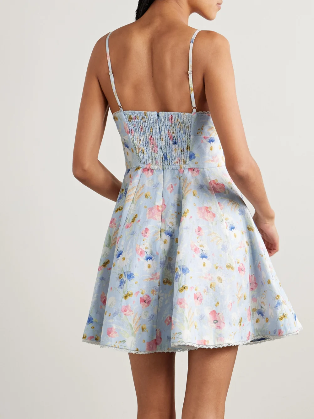 Back view of the Zimmermann Lucky Lace-trimmed Floral-print Linen Mini Dress