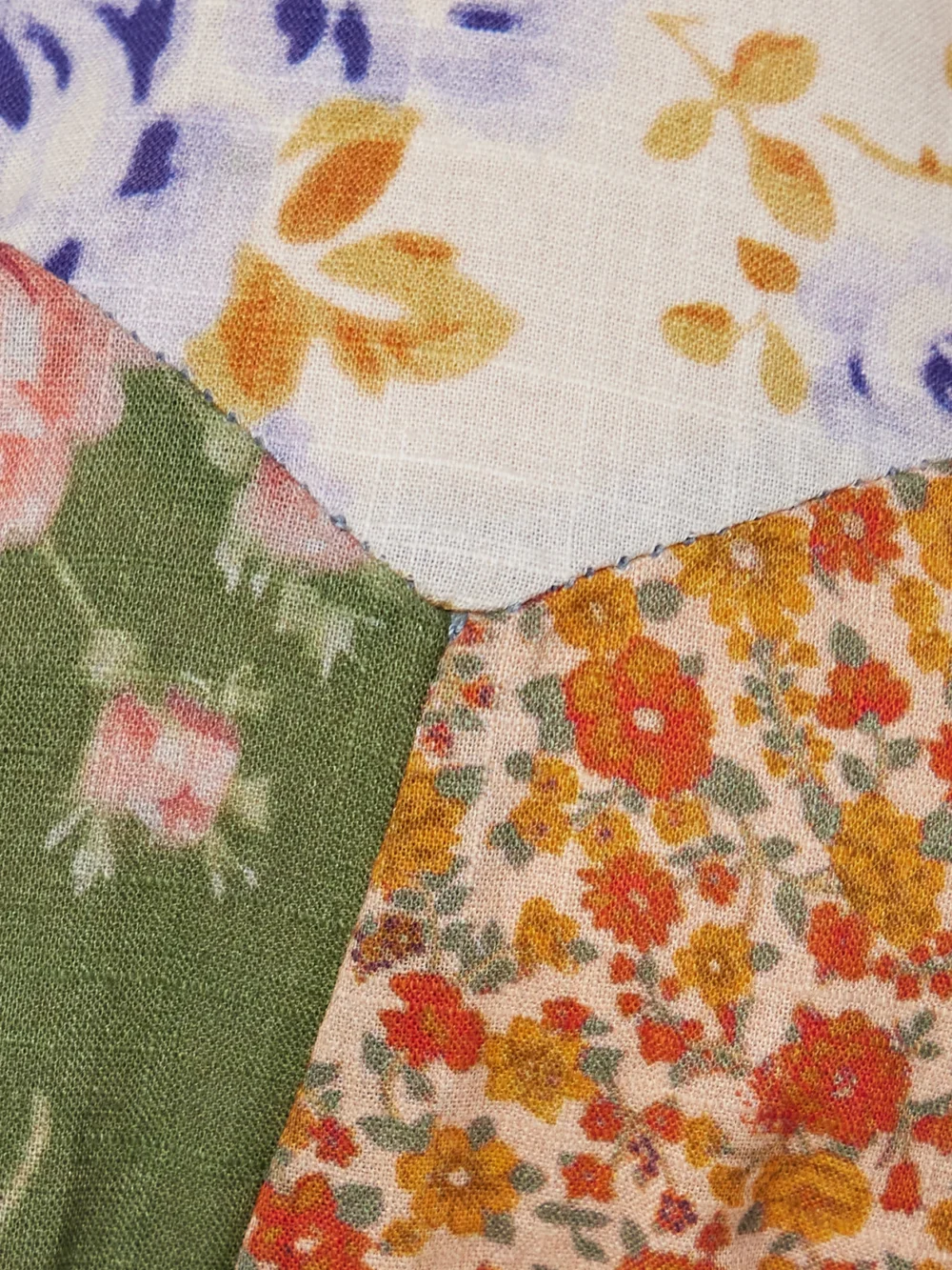 Close-up detail of the Zimmermann Lucky Patchwork Floral-print Cotton and Chambray Triangle Bikini
