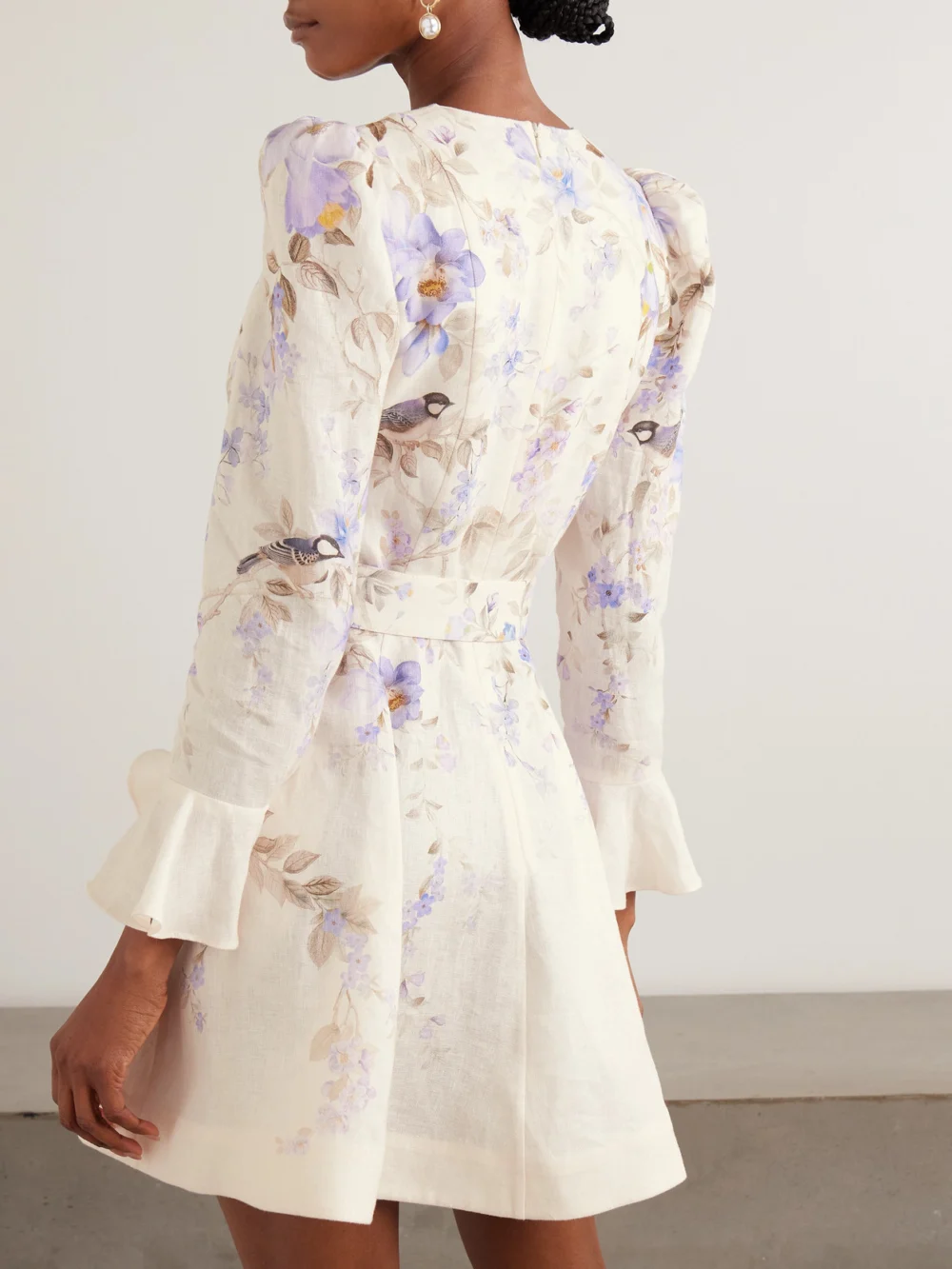 Back view of the Zimmermann Luna Belted Floral-print Linen Mini Dress