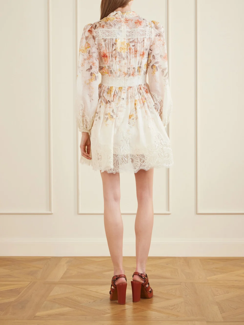 Back view of the Zimmermann Luna Lace-trimmed Linen and Cotton-blend Mini Dress