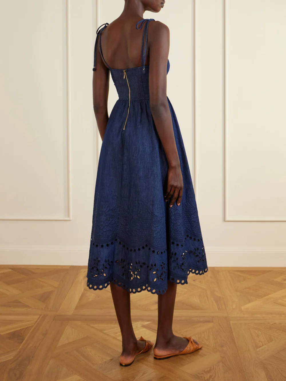 Back view of the Zimmermann Mahon Broderie Anglaise Cotton-denim Midi Dress