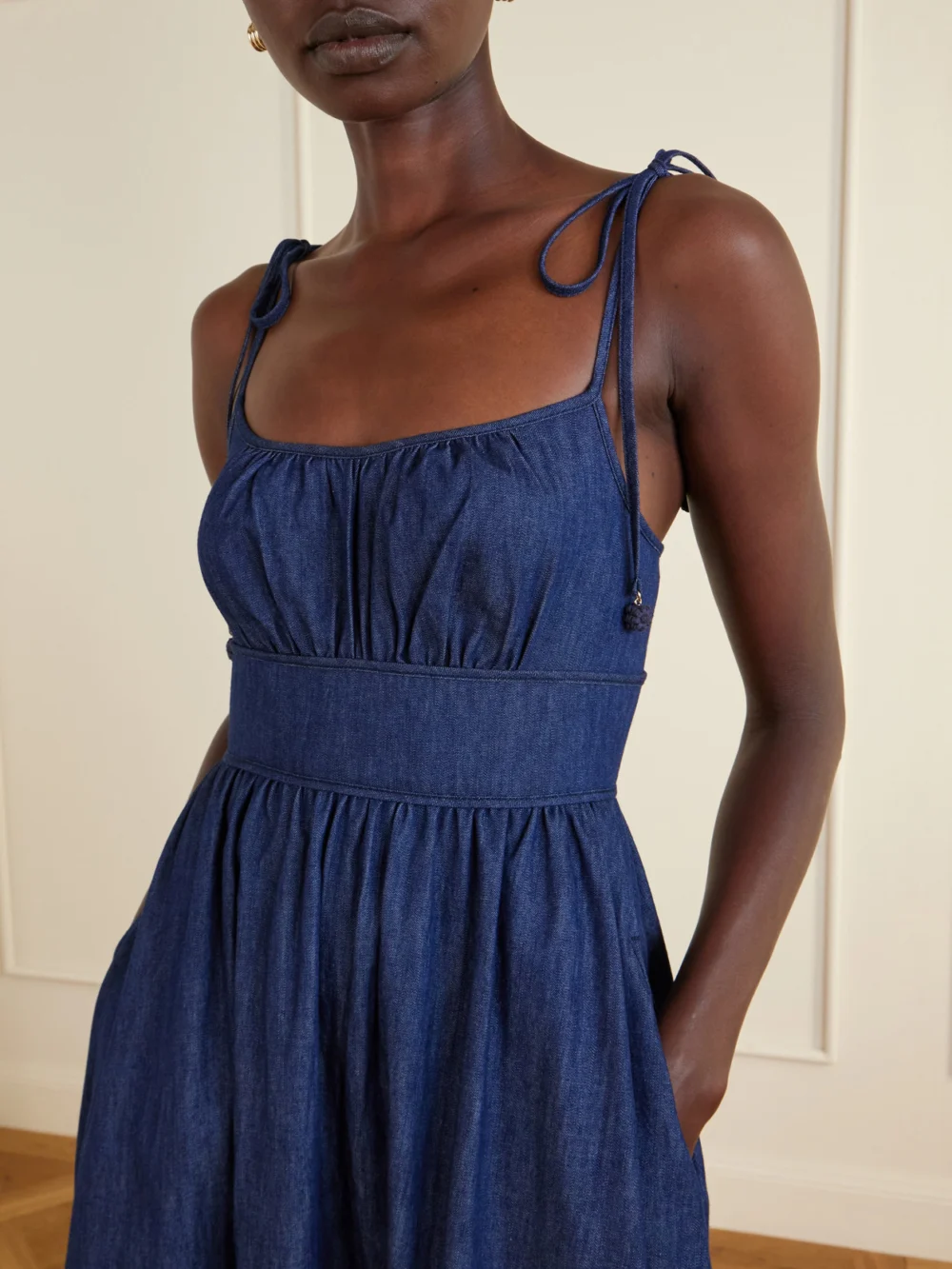 Close-up detail of the Zimmermann Mahon Broderie Anglaise Cotton-denim Midi Dress