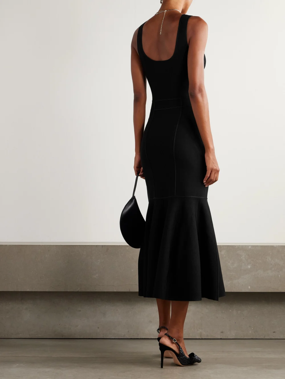 Back view of the Zimmermann Paneled Ruffled Knitted Midi Dress