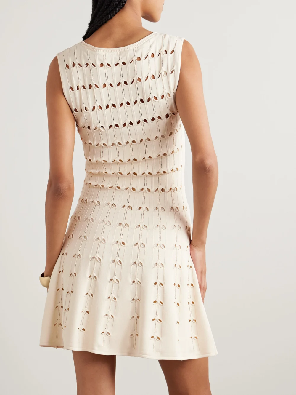 Back view of the Zimmermann Rhiannon Cutout Pointelle-knit Cotton-blend Mini Dress