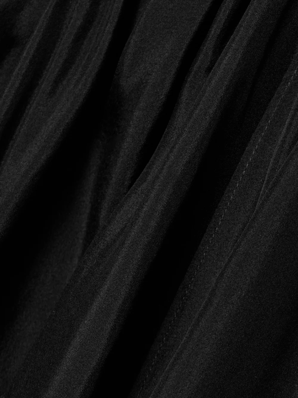 Close-up detail of the Zimmermann Rhiannon Open-back Draped Organic Silk Halterneck Maxi Dress