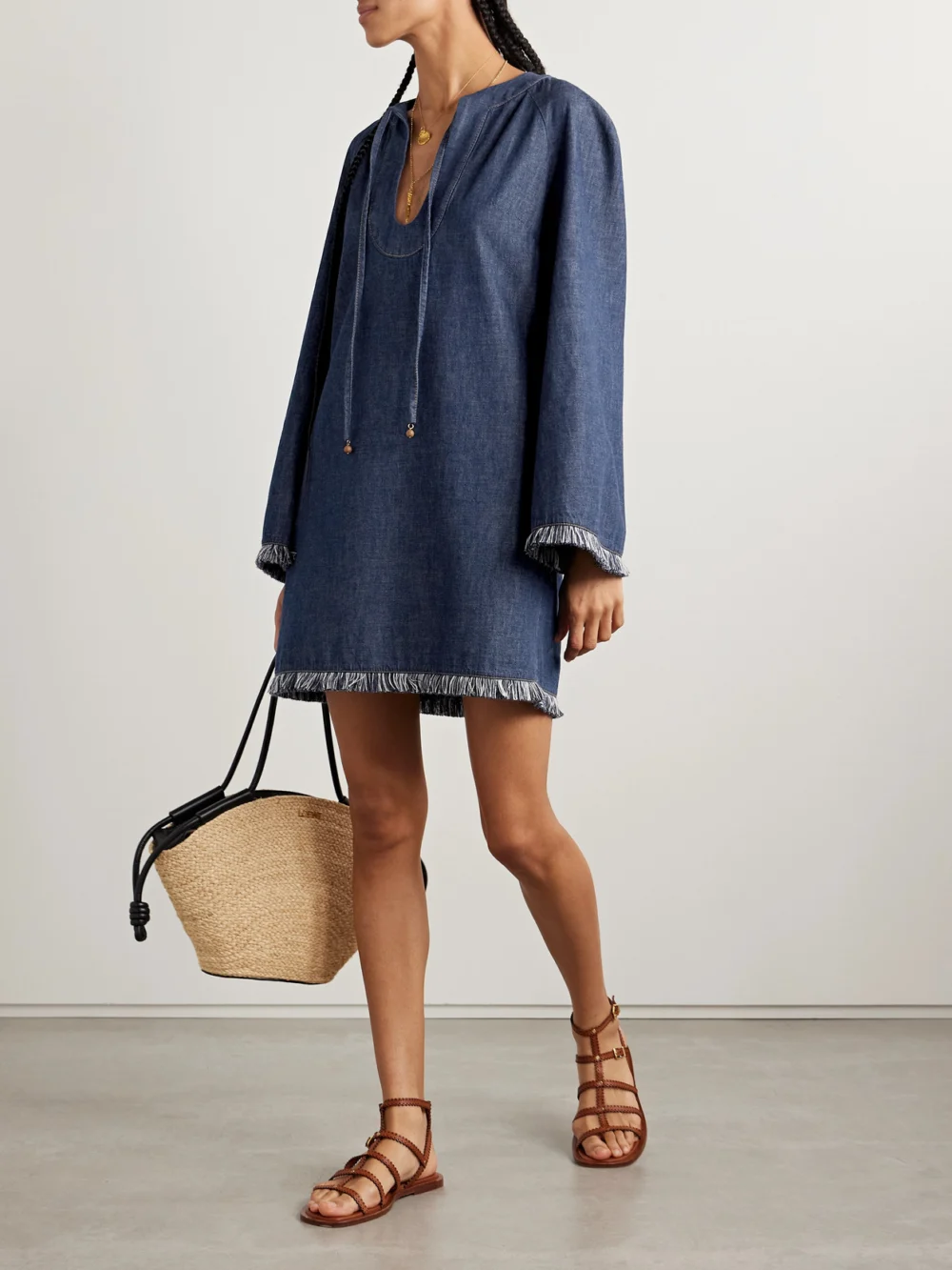 Zimmermann Rhiannon Tie-detailed Frayed Denim Mini Dress, worn by a model