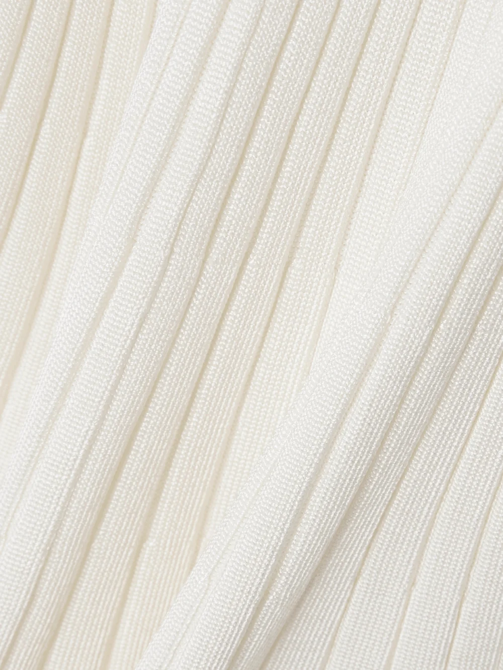 Close-up detail of the Zimmermann Ribbed-knit Mini Dress