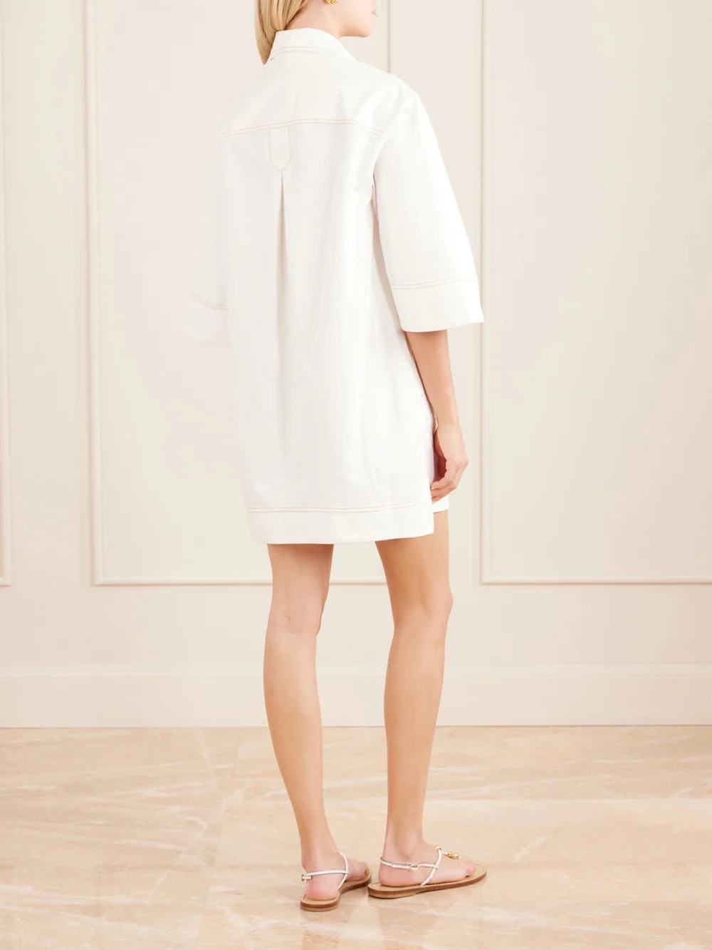 Back view of the Zimmermann Roselight Paneled Denim Mini Dress