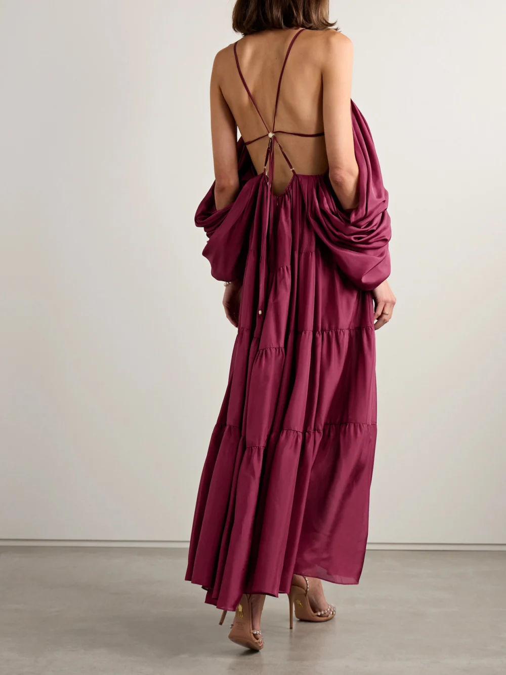 Back view of the Zimmermann Tallow Cold-shoulder Pleated Tiered Silk-satin Maxi Dress