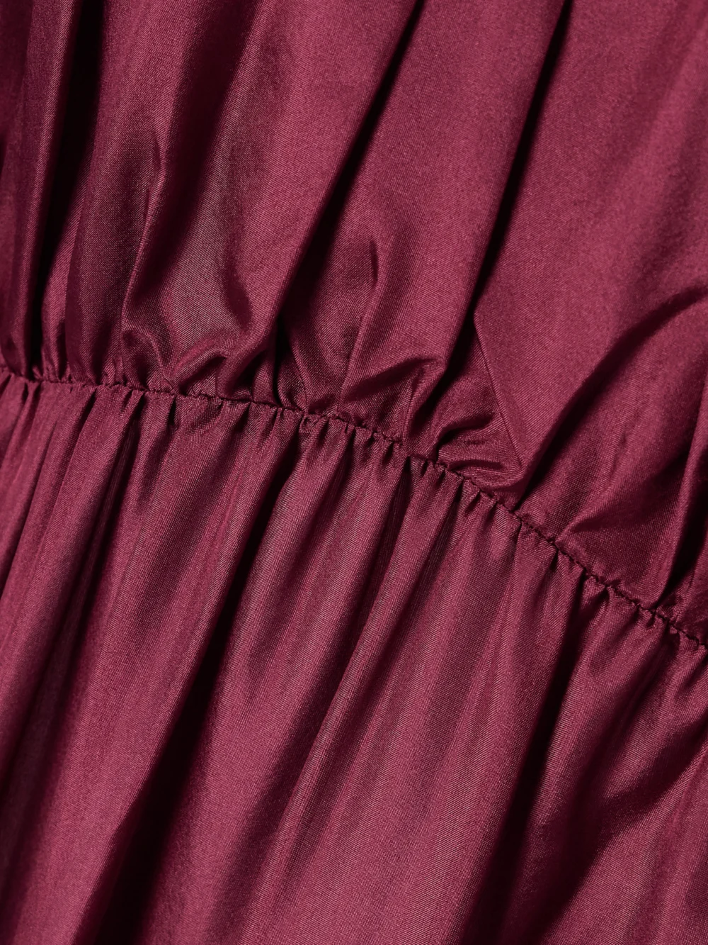 Close-up detail of the Zimmermann Tallow Cold-shoulder Pleated Tiered Silk-satin Maxi Dress