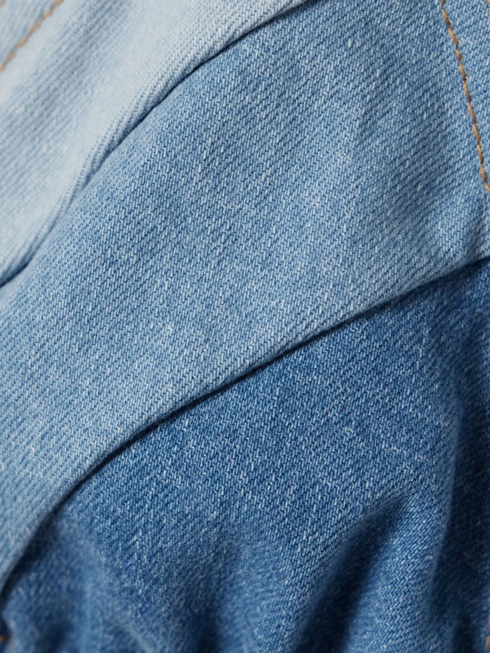 Close-up detail of the Zimmermann Tallow Denim Triangle Bikini