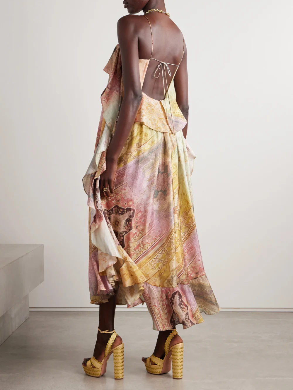 Back view of the Zimmermann Tallow Ruffled Printed Silk Maxi Dress