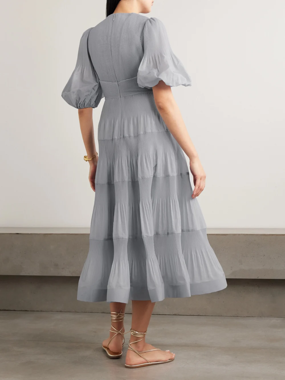 Back view of the Zimmermann Tiered Plissé Silk-organza Midi Dress