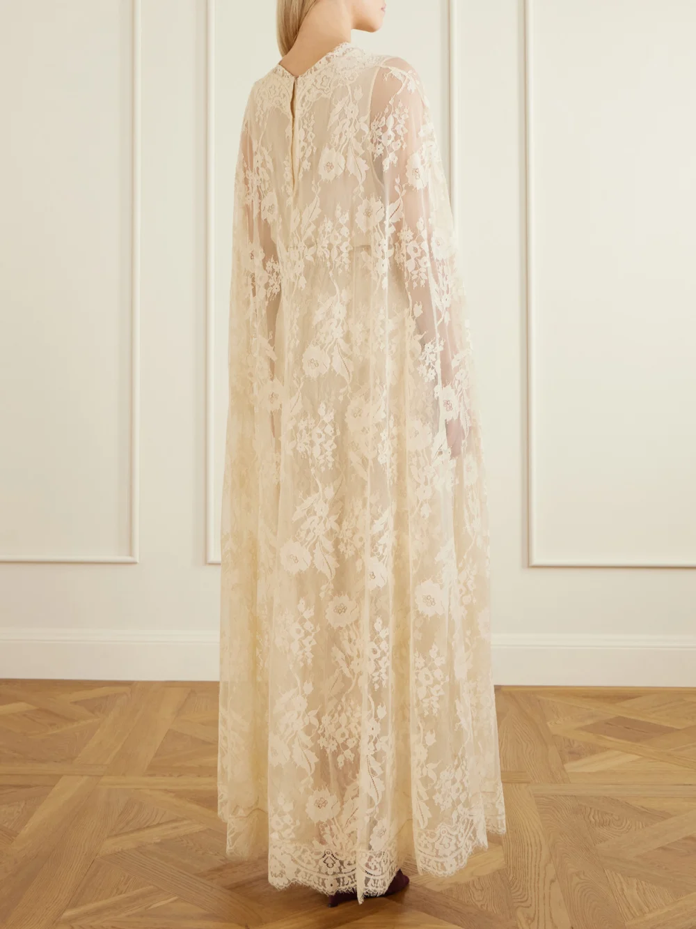 Back view of the Zimmermann Valiant Belted Cape-effect Lace Maxi Dress