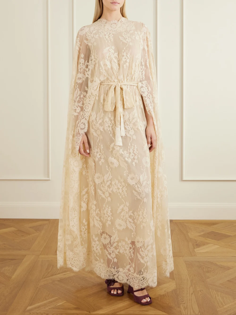Zimmermann Valiant Belted Cape-effect Lace Maxi Dress, worn by a model