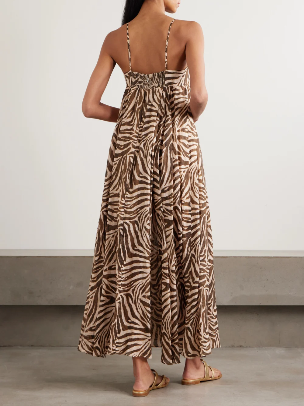 Back view of the Zimmermann Wanderlust Gathered Zebra-print Cotton Maxi Dress