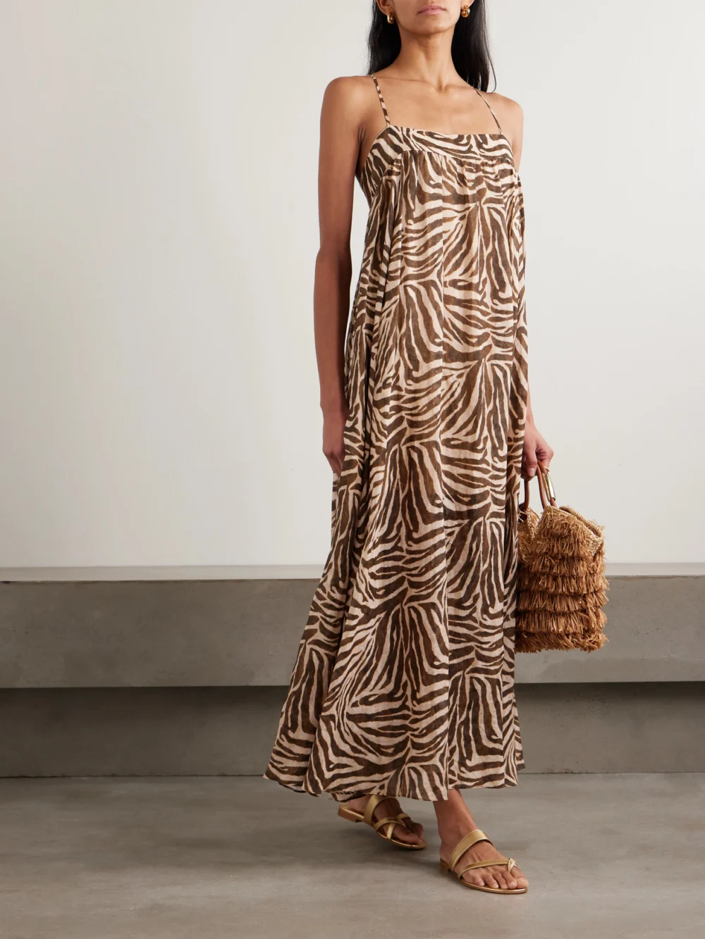 Zimmermann Wanderlust Gathered Zebra-print Cotton Maxi Dress, worn by a model