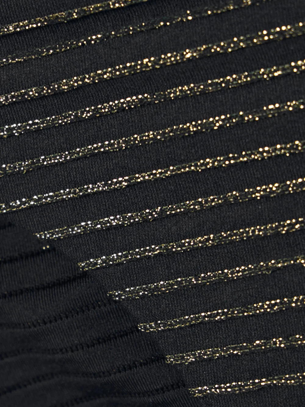 Close-up detail of the Zimmermann Waverly Chain-embellished Metallic Striped Bikini