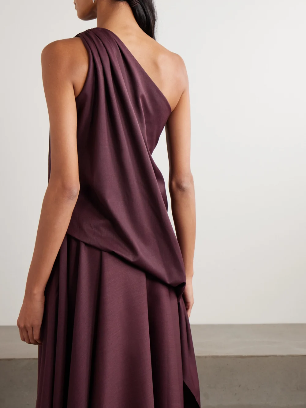 Back view of the Abadia Ayla One-shoulder Draped Wool-blend Twill Top