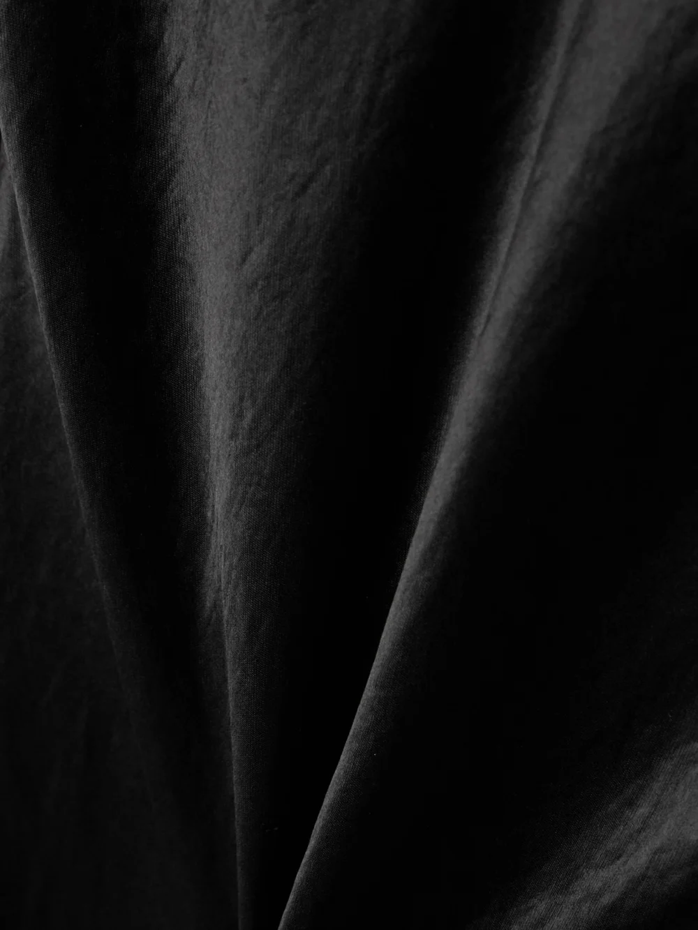 Close-up detail of the Abadia Draped Hammered-satin Gown