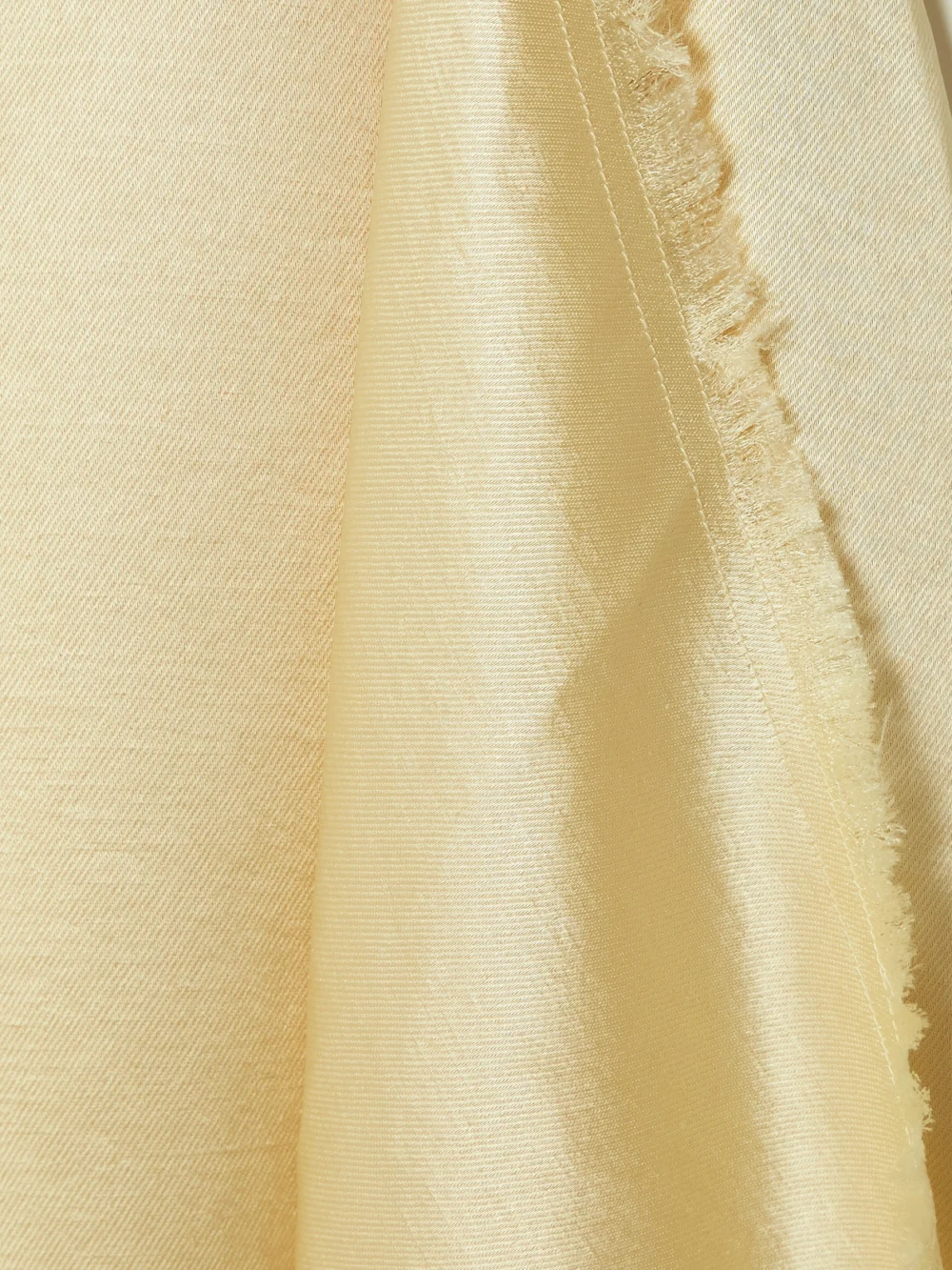Close-up detail of the Abadia Verlap Draped Frayed Dupioni Wrap Maxi Skirt