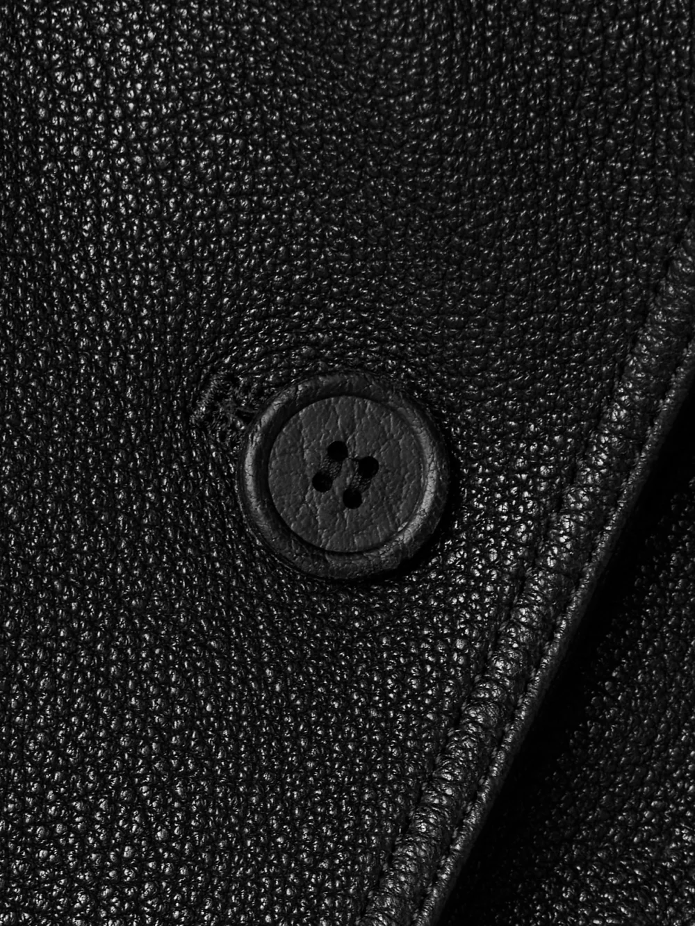 Close-up detail of the Acne Studios Double-breasted Textured-leather Jacket