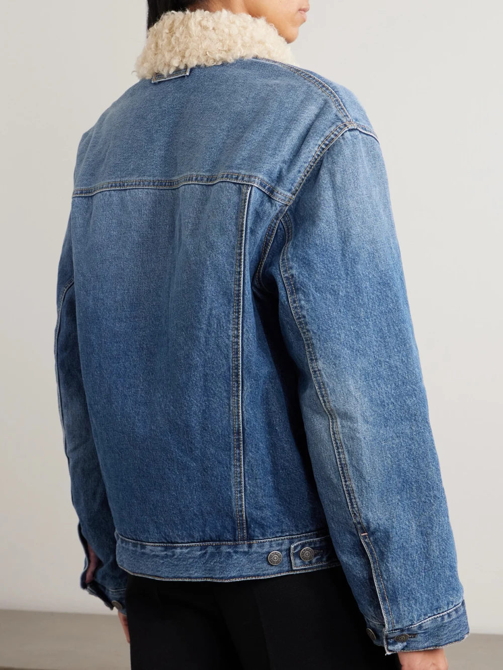 Back view of the Acne Studios Fleece-trimmed Padded Denim Jacket