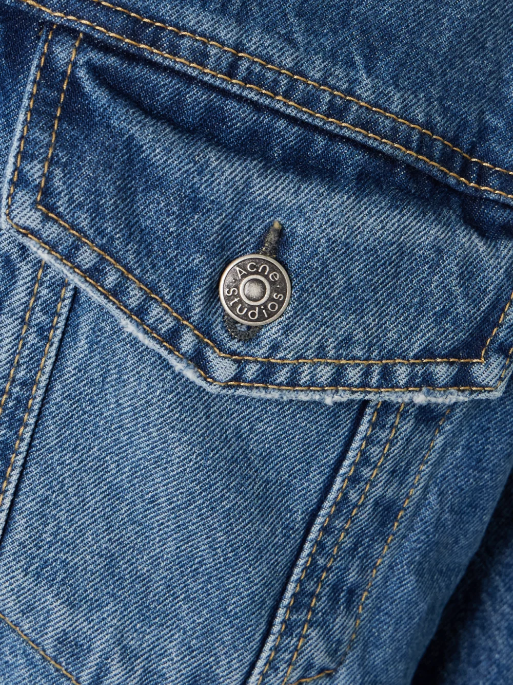 Close-up detail of the Acne Studios Fleece-trimmed Padded Denim Jacket