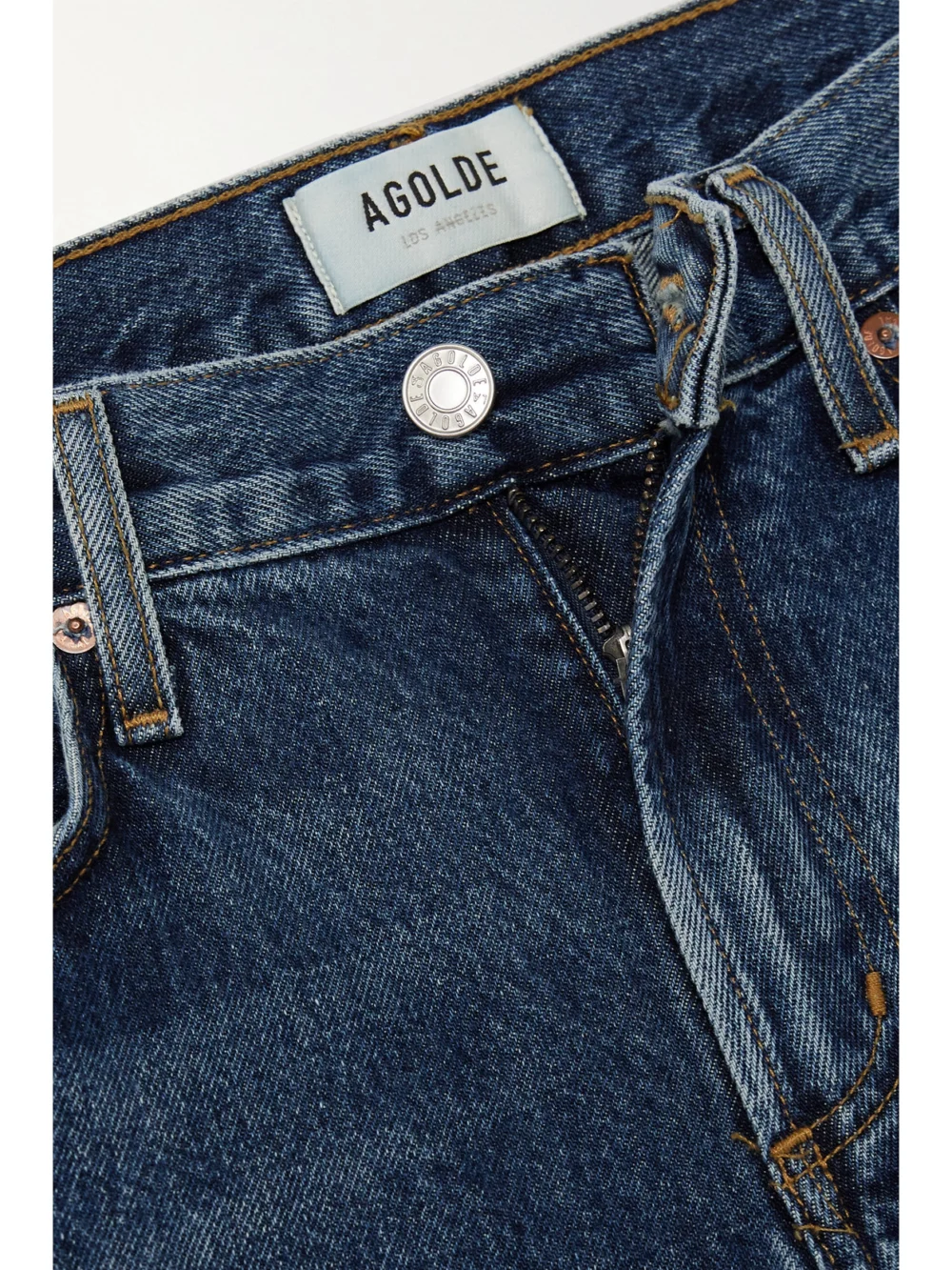 Close-up detail of the Agolde Clara Baggy Organic Low-rise Flared Jeans