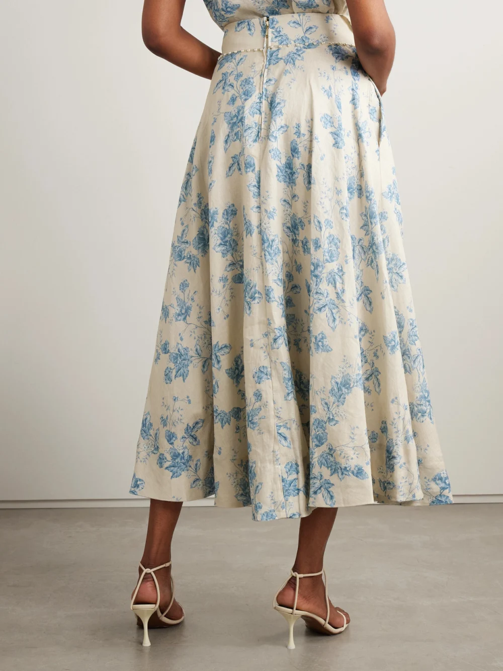 Back view of the Agua by Agua Bendita Bergamota Bougainvillea Embellished Floral-print Linen Midi Skirt