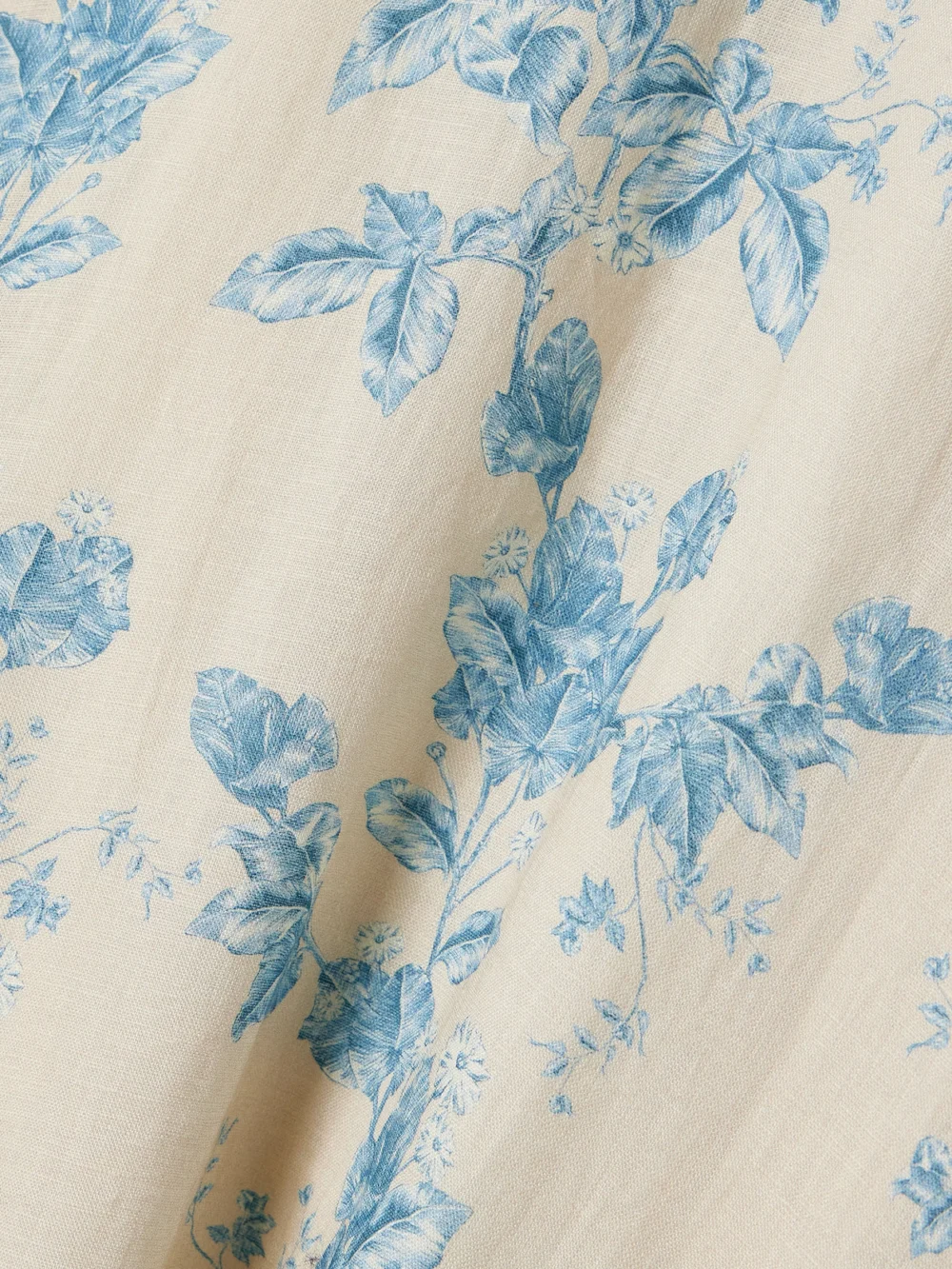 Close-up detail of the Agua by Agua Bendita Bergamota Bougainvillea Embellished Floral-print Linen Midi Skirt
