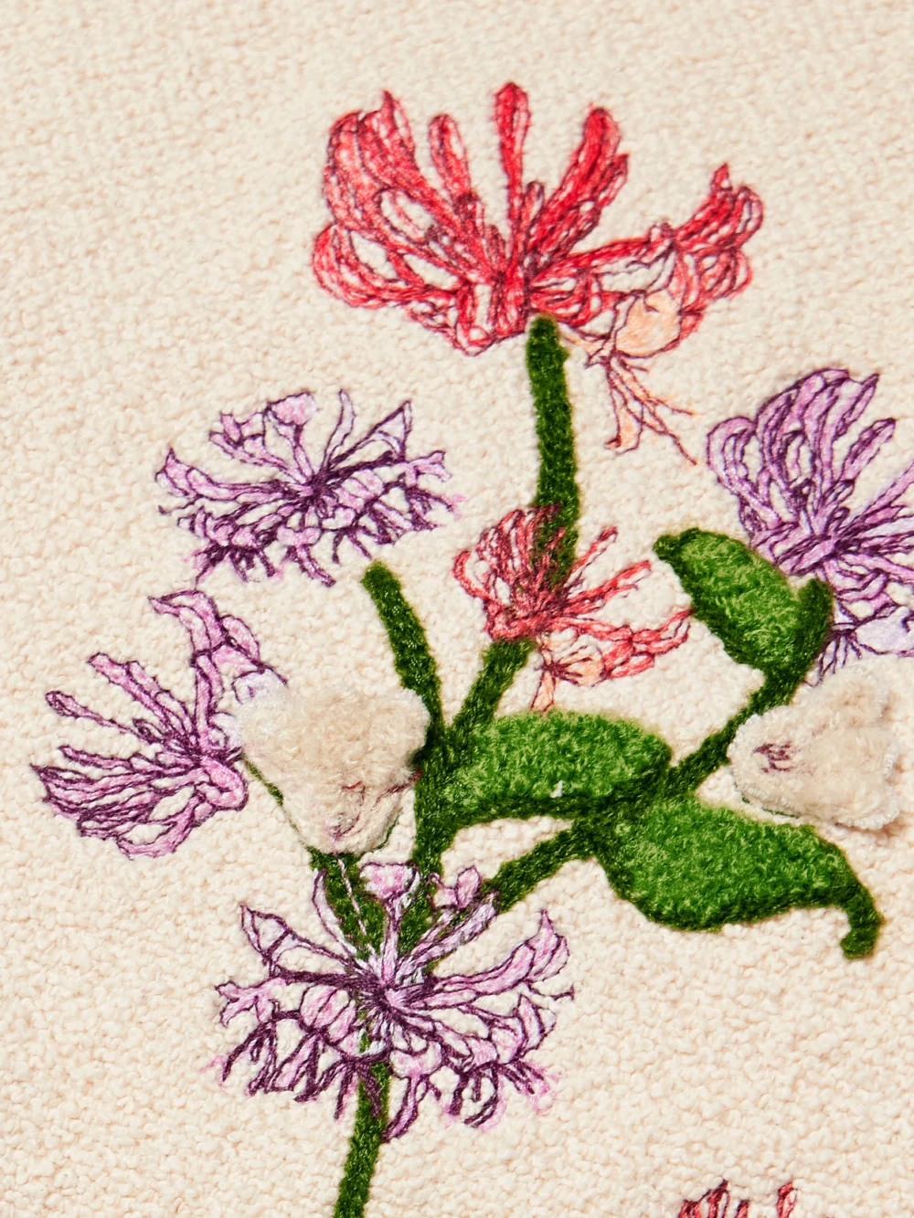 Close-up detail of the Agua by Agua Bendita Carlota Honeysuckle Cropped Appliquéd Embroidered Cotton-blend Bouclé Halterneck