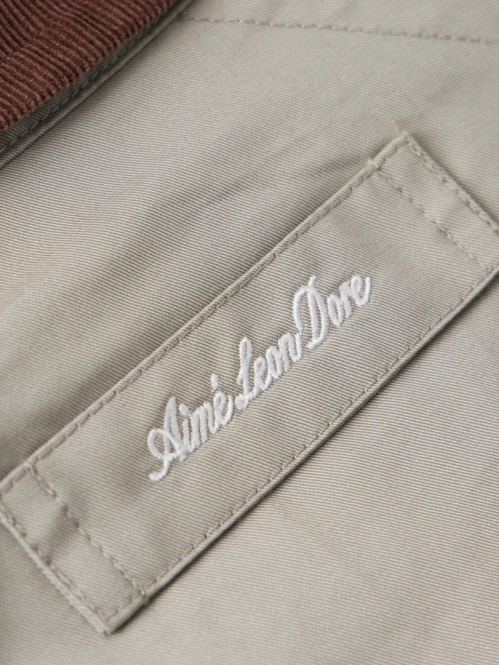 Close-up detail of the Aimé Leon Dore Corduroy-trimmed Embroidered Cotton-twill Jacket
