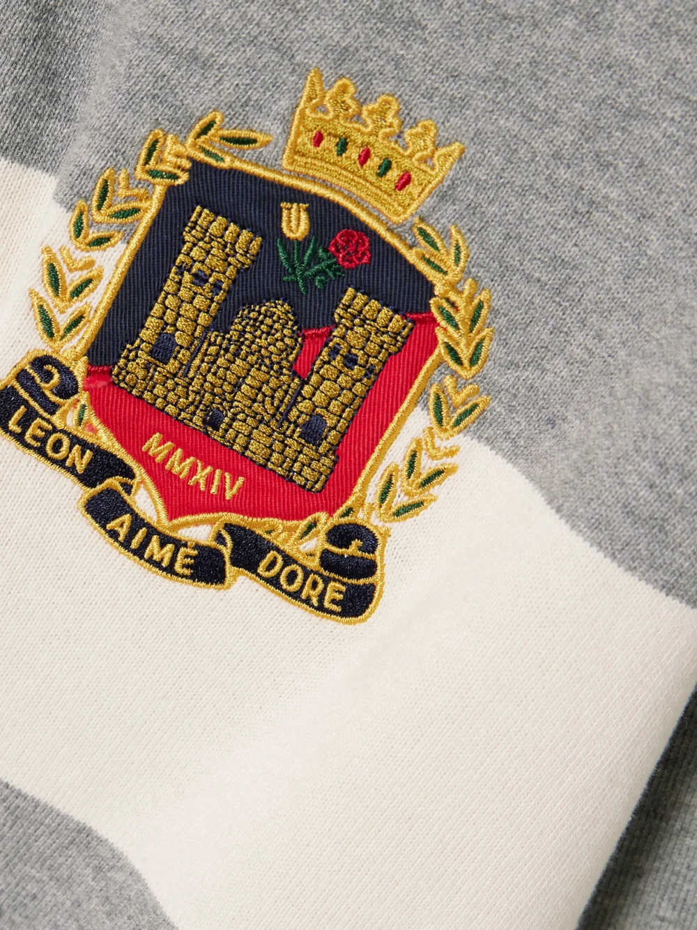 Close-up detail of the Aimé Leon Dore Script Embroidered Printed Striped Corduroy-trimmed Cotton Rugby Shirt