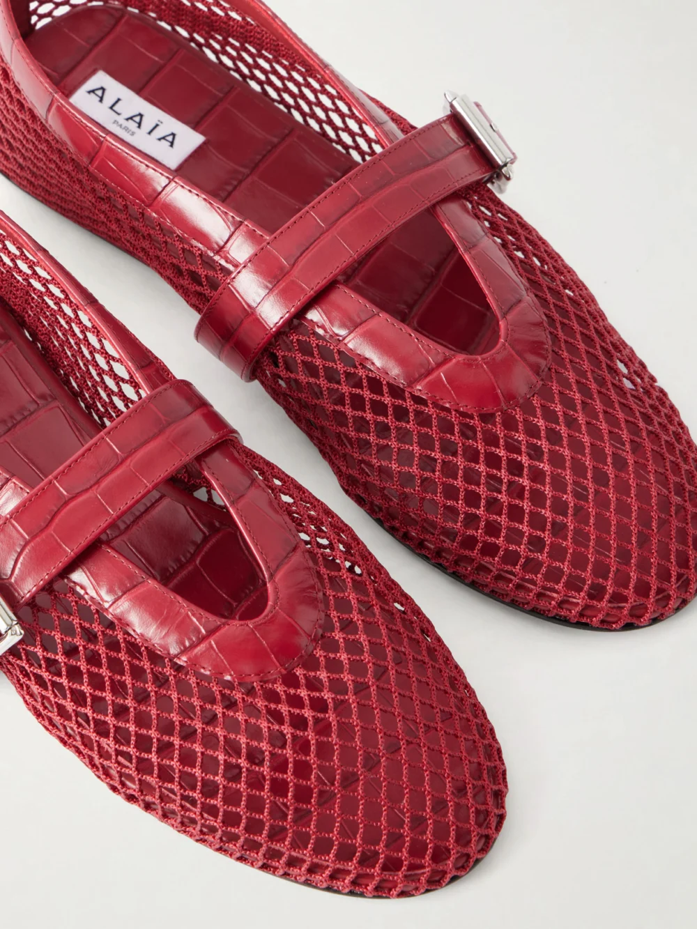 Close-up detail of the Alaïa La Ballerine Croc-effect Leather-trimmed Mesh Ballet Flats