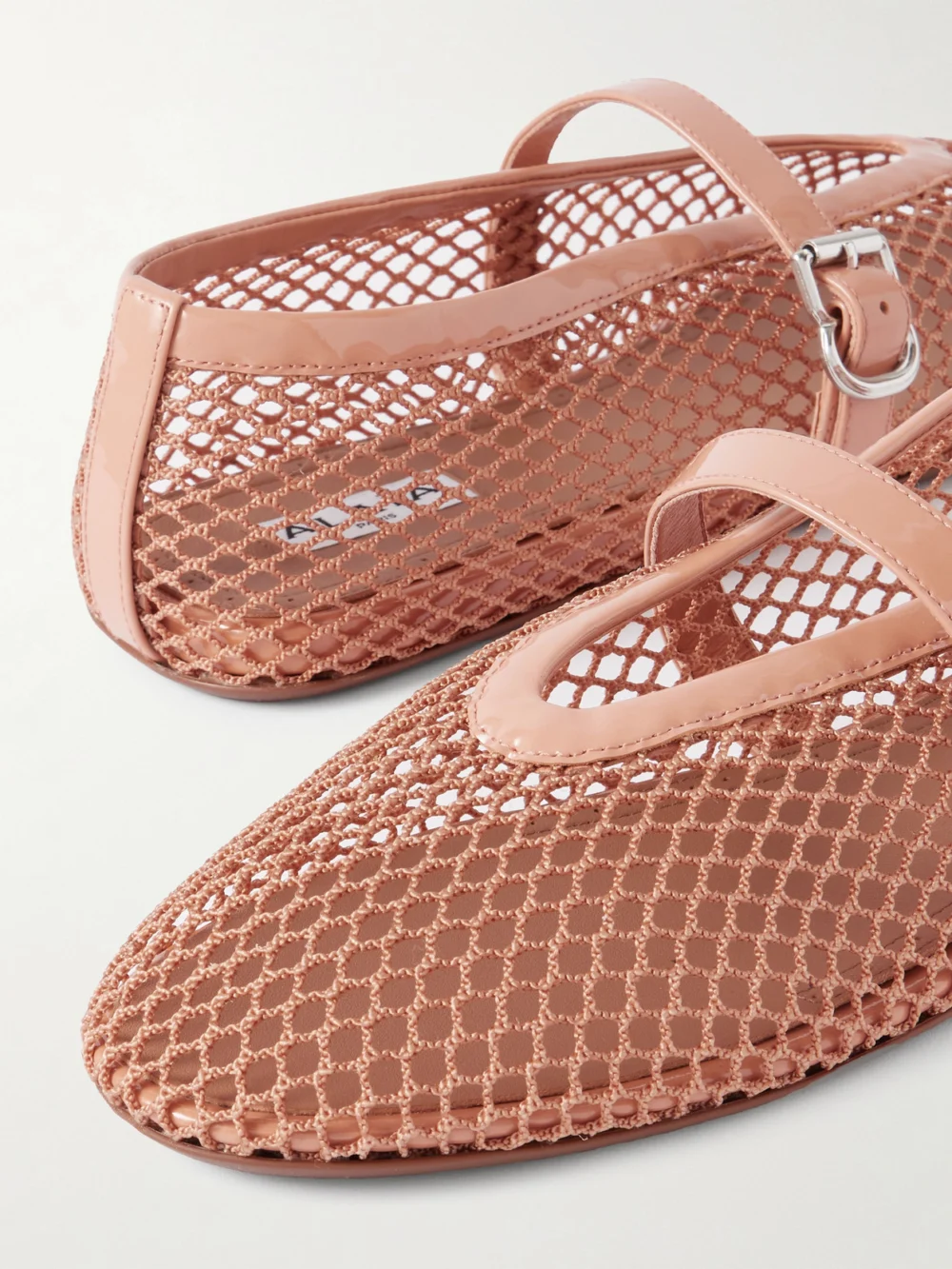 Close-up detail of the Alaïa Patent Leather-trimmed Mesh Ballet Flats