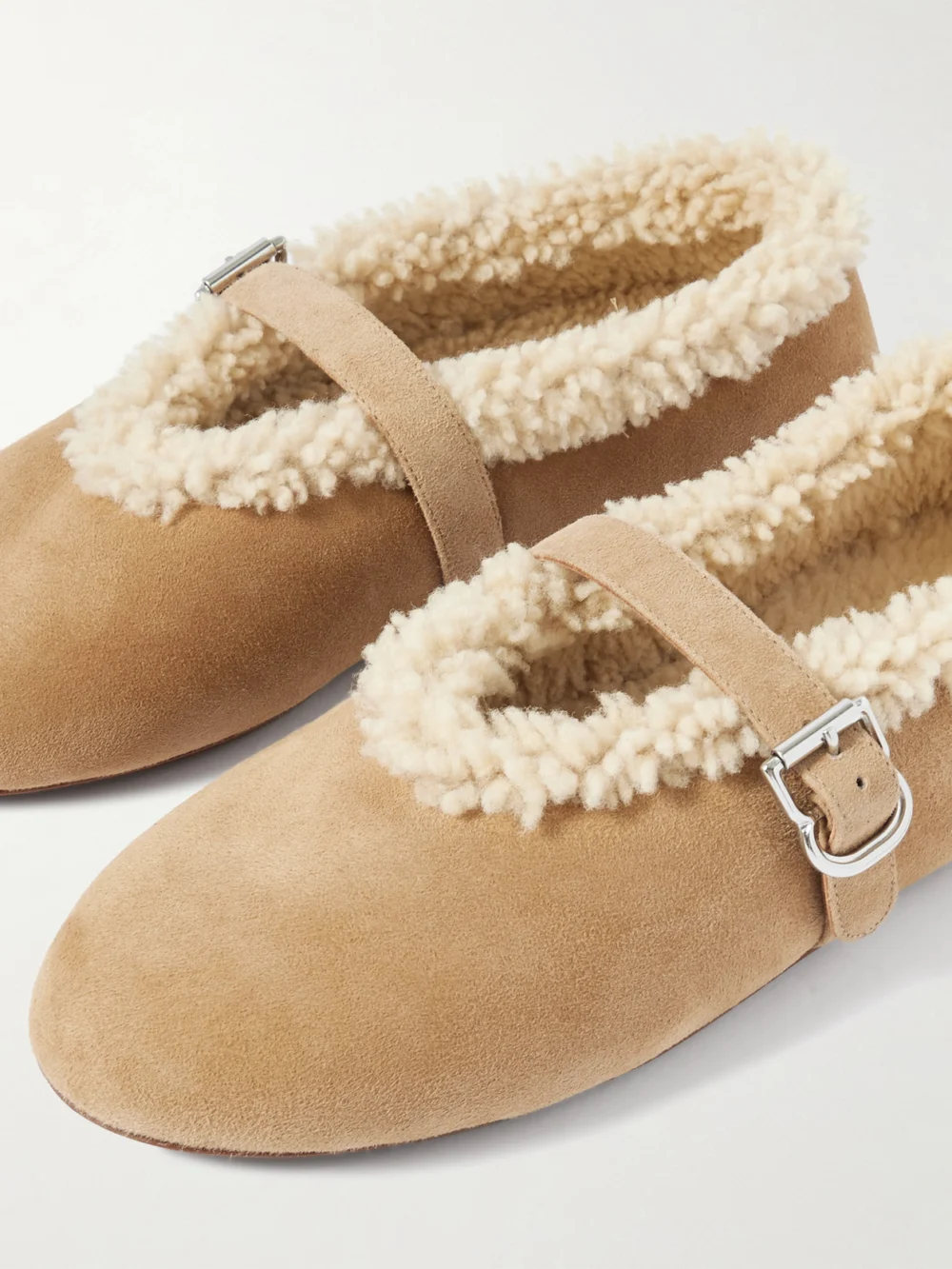 Close-up detail of the Alaïa Shearling-trimmed Suede Ballet Flats