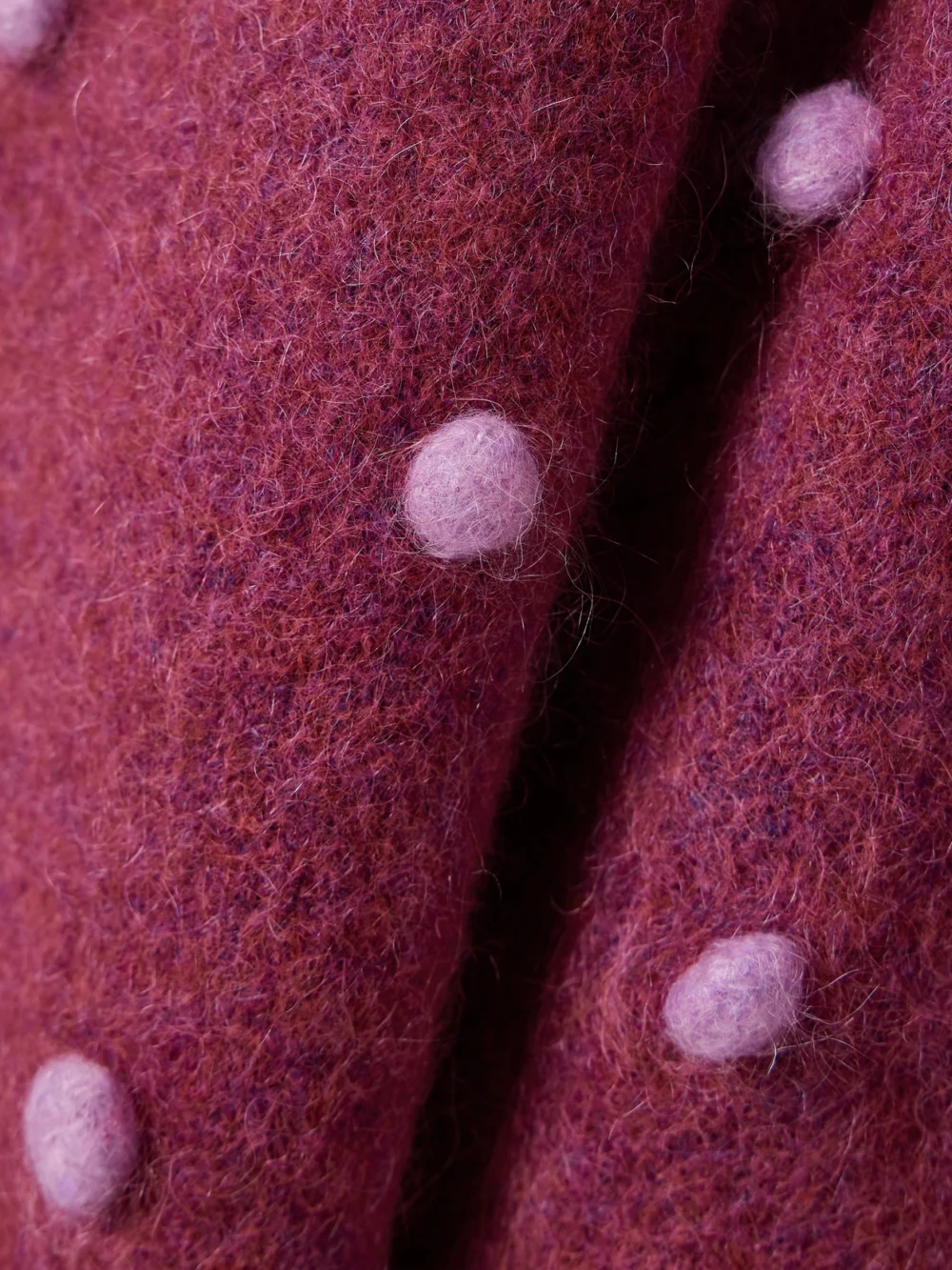 Close-up detail of the Alémais Elia Pompom-embellished Knitted Sweater