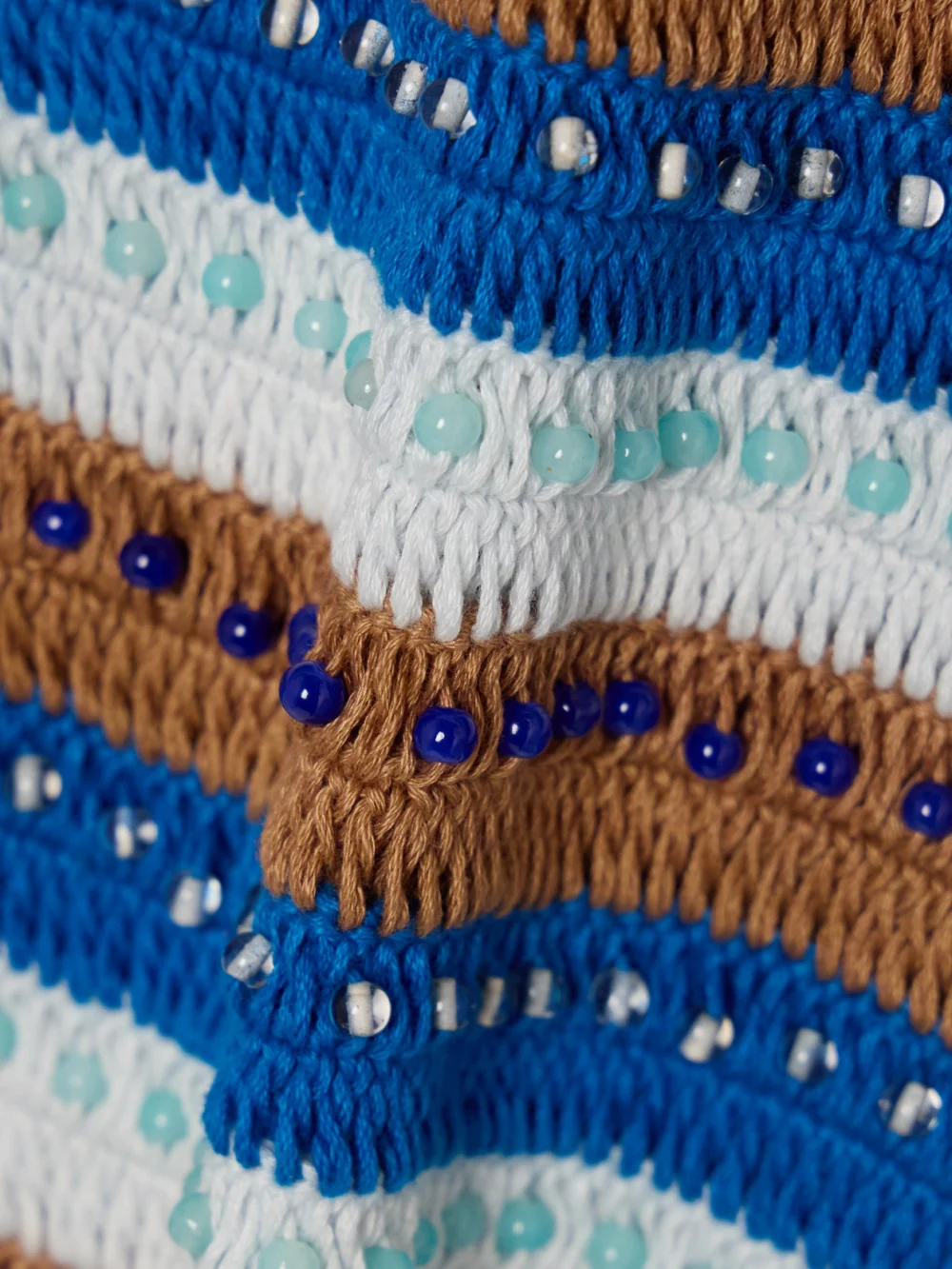 Close-up detail of the Alix Of Bohemia Tina Lowtide Embellished Striped Crocheted Cotton Tank