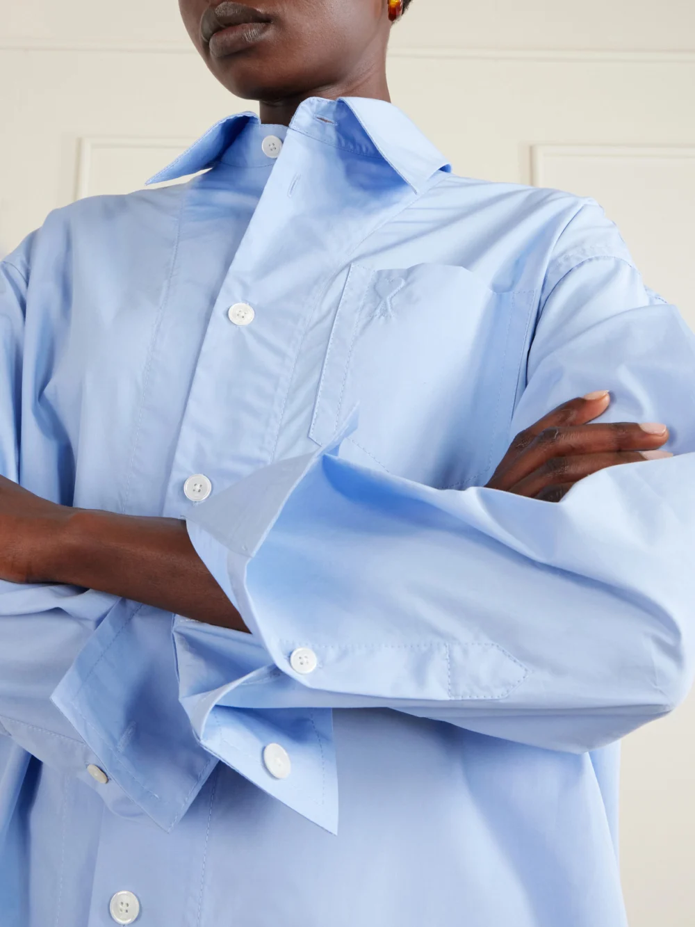 Close-up detail of the Ami Paris Embossed Cotton-poplin Shirt Dress